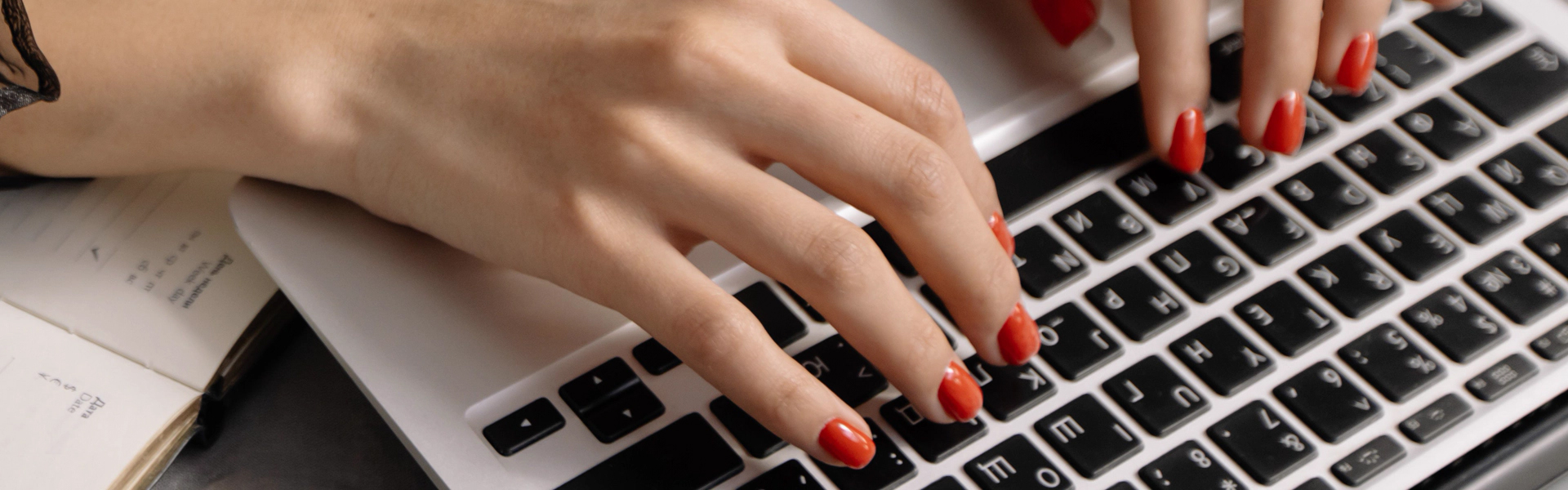 Hands typing on a computer keyboard - Wedding Planner Services