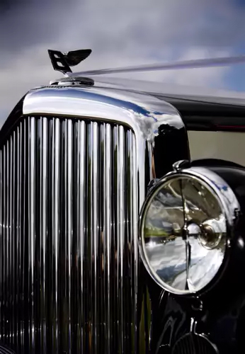 A close up of a wedding car